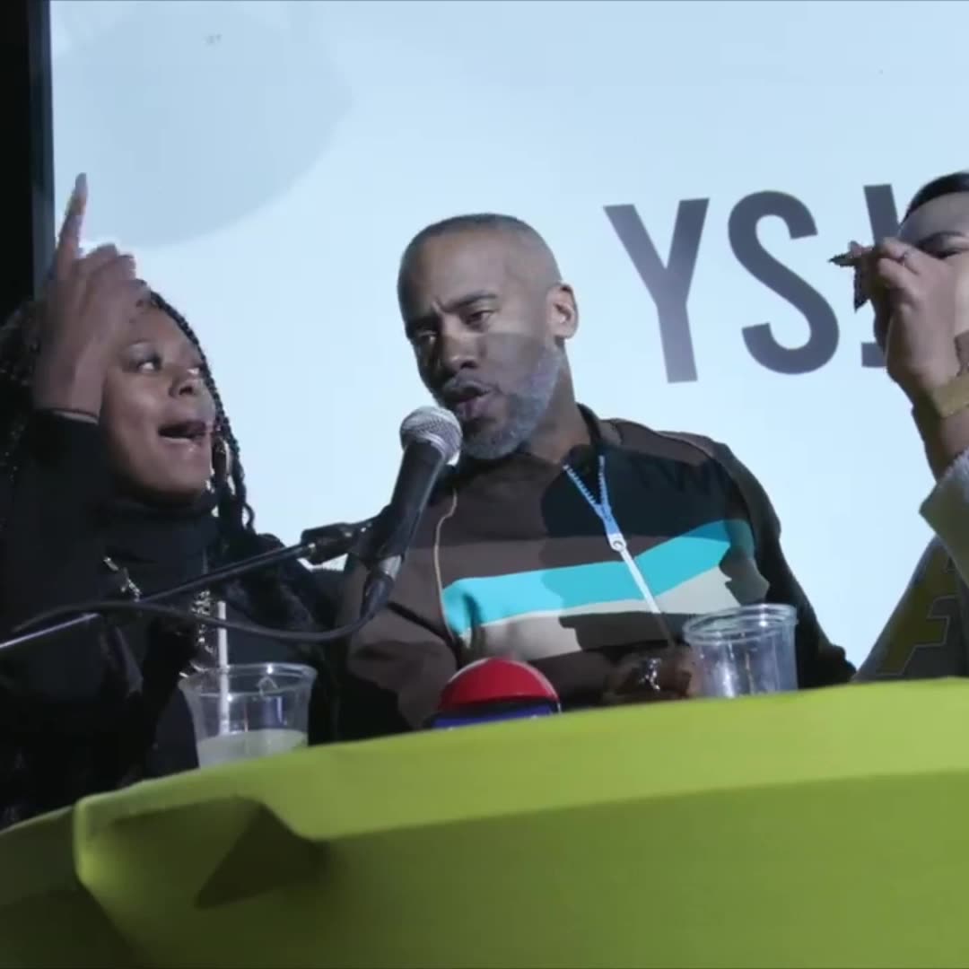 A player laughing at the podium mic