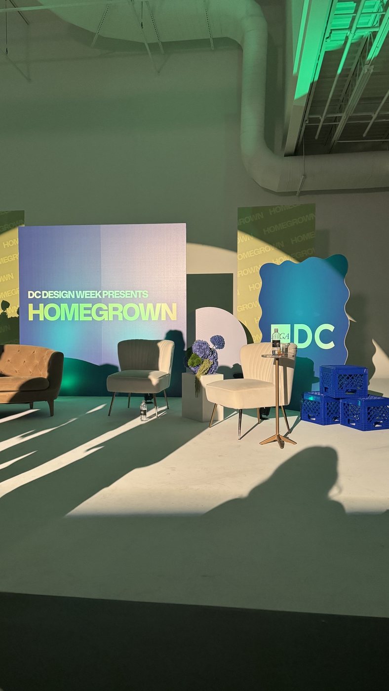 The Homegrown set: a “DC Design Week Presents Homegrown” board between lounge chairs and blue DC panels