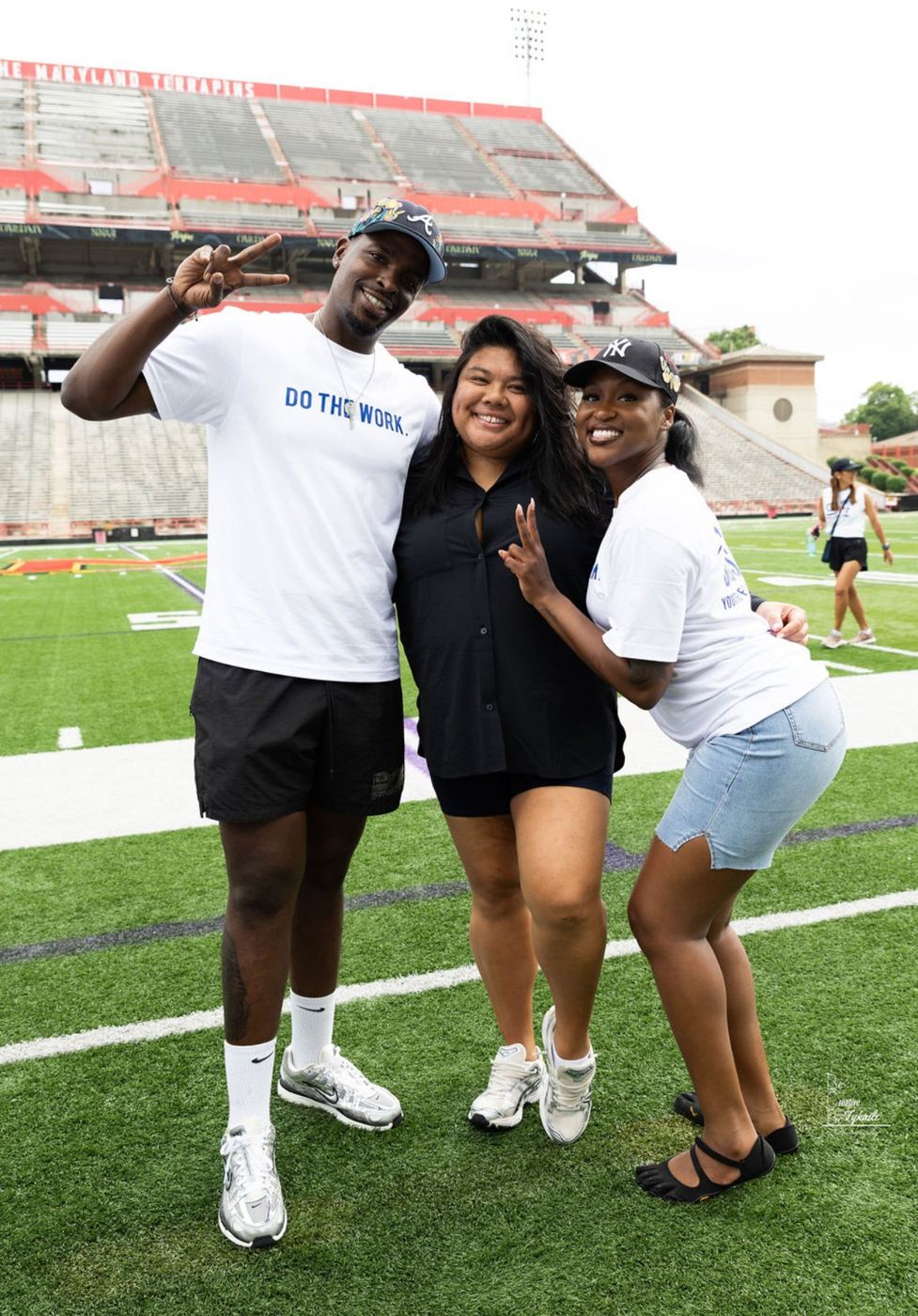 DOTHEWORK crew on the field at Maryland Stadium for Diggs Day