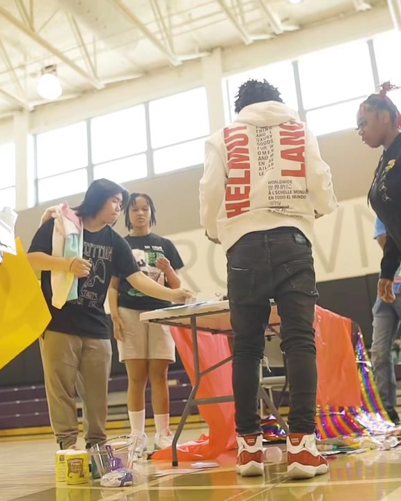 DOTHEWORK crew setting up activity stations before doors