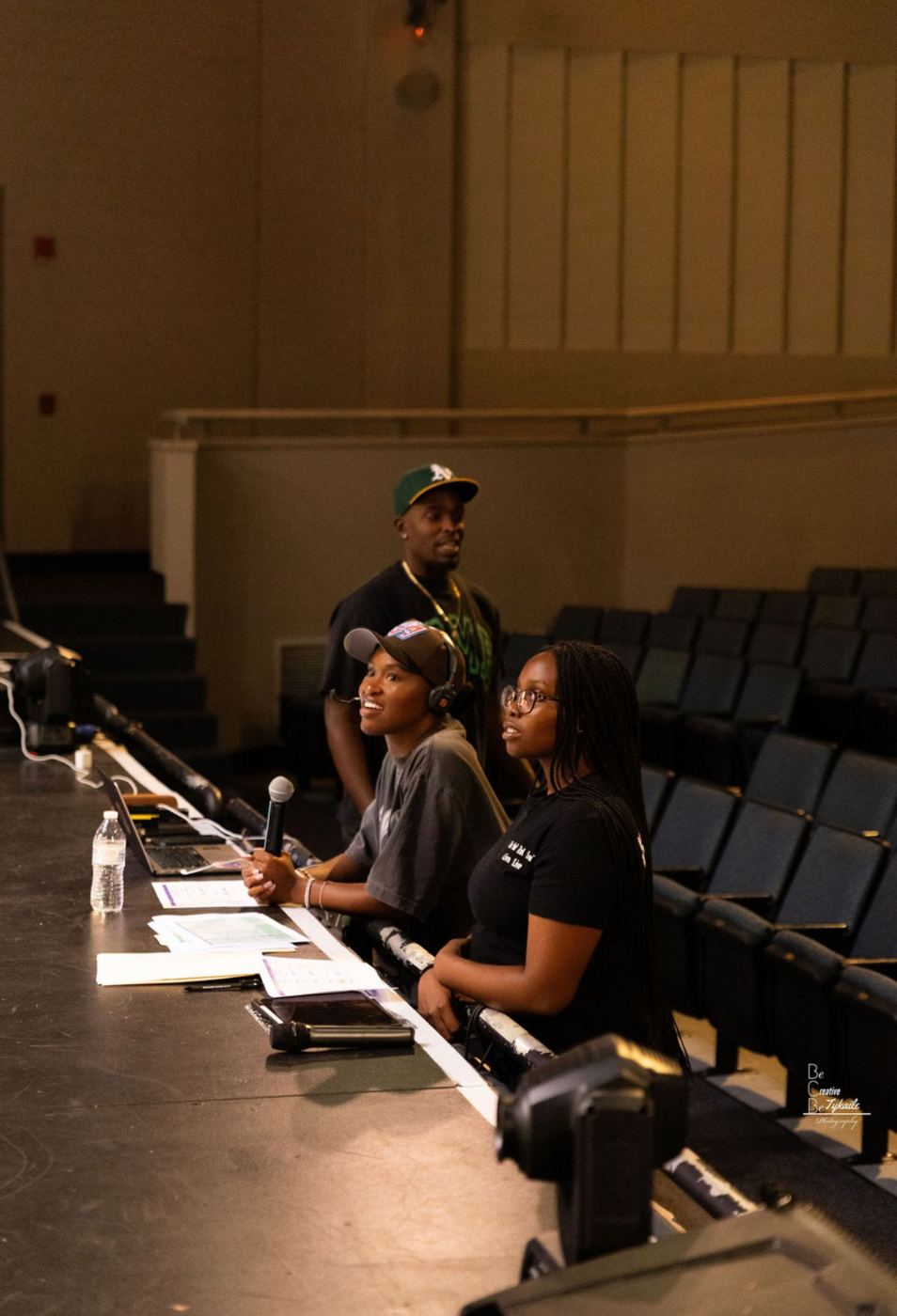 DOTHEWORK crew at the tech table on headset during MWMP Live!