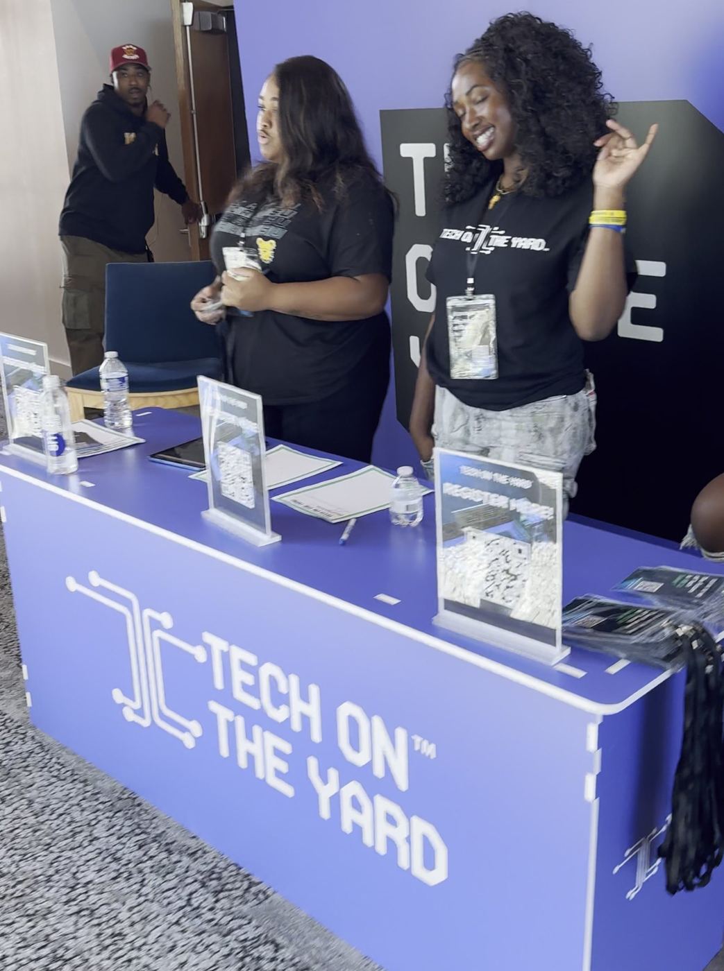 DOTHEWORK crew running the Tech on the Yard check-in table