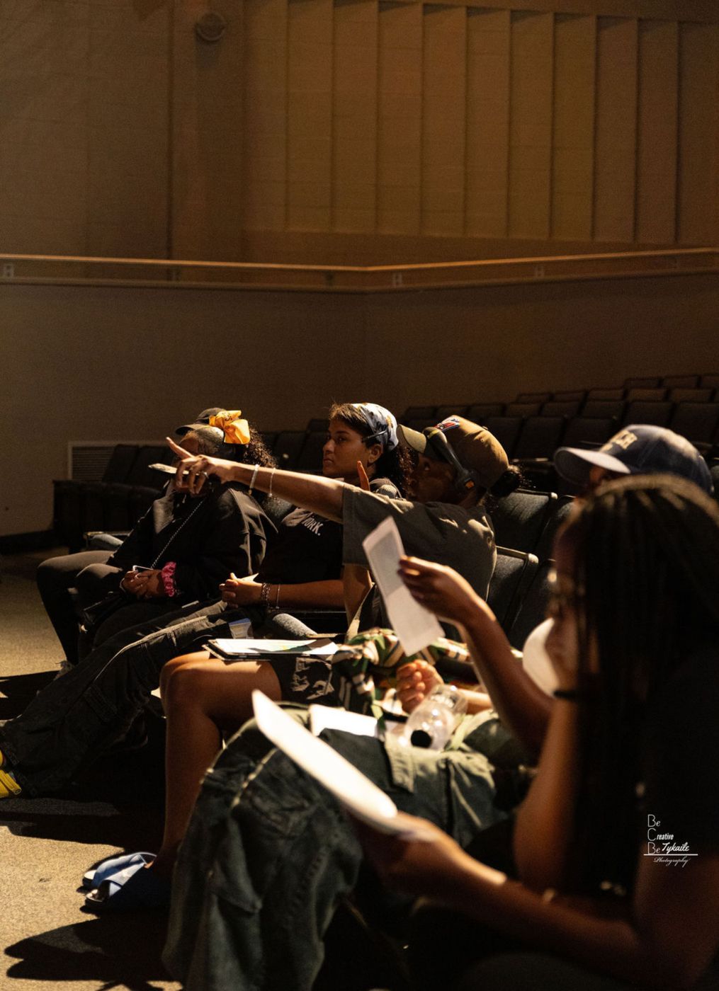 Youth crew in the house seats with paperwork during tech